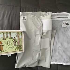 The Ollie Swaddle (stone) VGUC, Original box and has mesh wash bag.